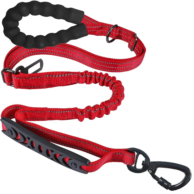 Red dog leash with shock-absorbing bungee, padded handle, and reflective stitching for safe walks